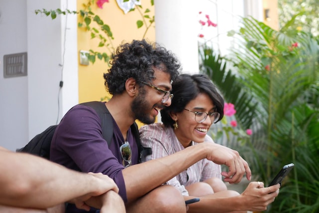 Two friends looking on their phone