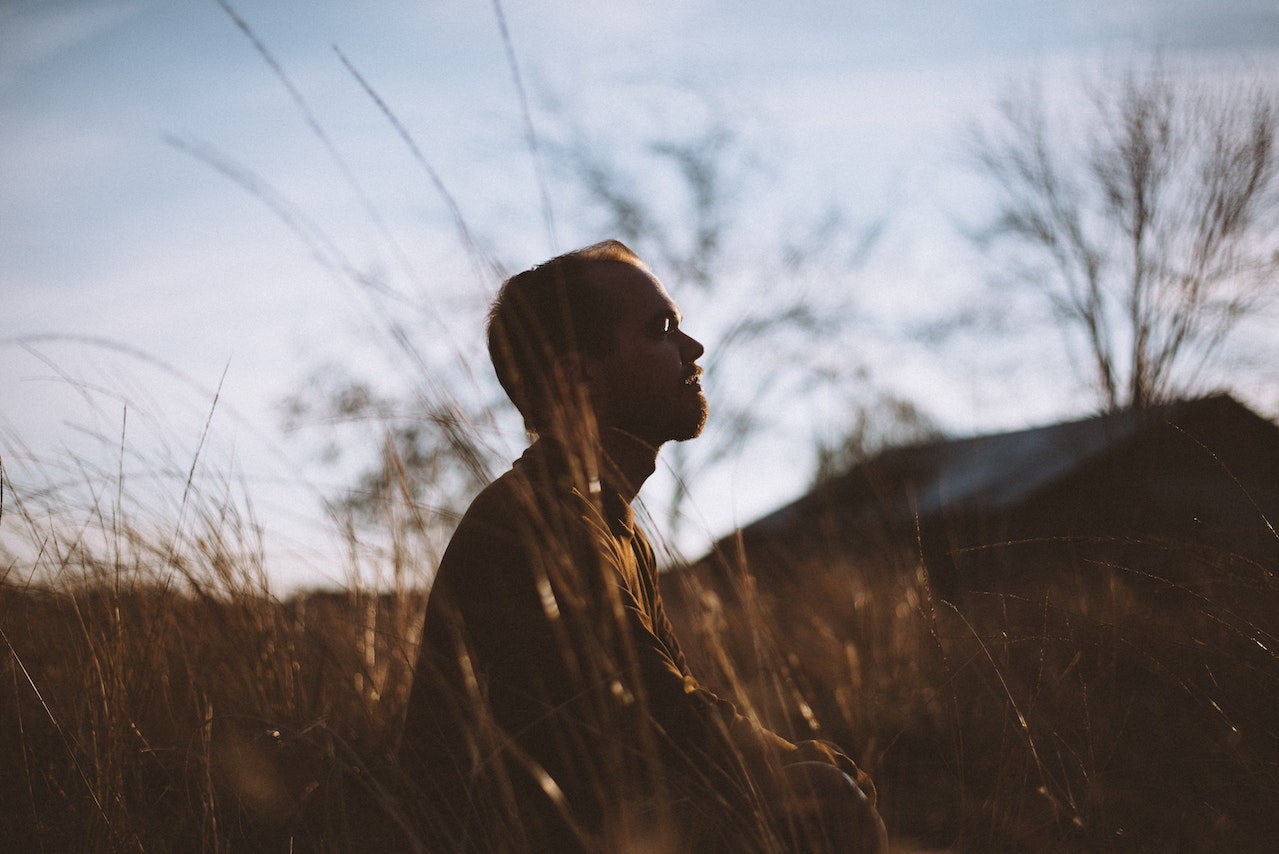 Person meditating outdoors