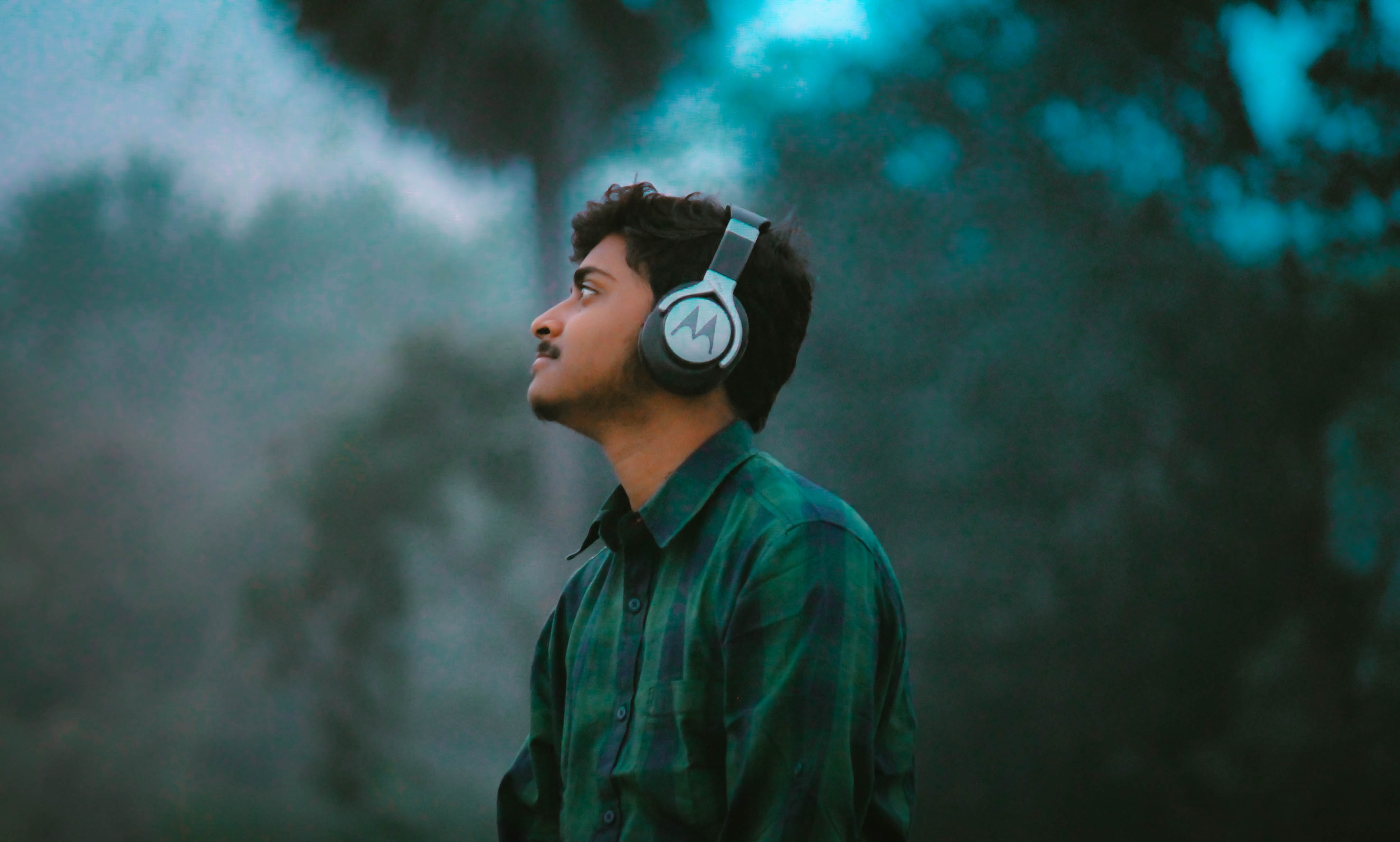 Person with headphones outside