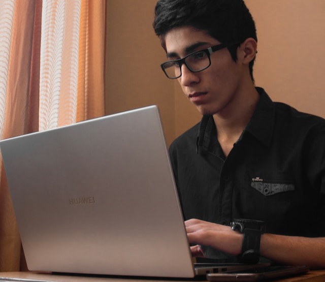 Man typing on laptop